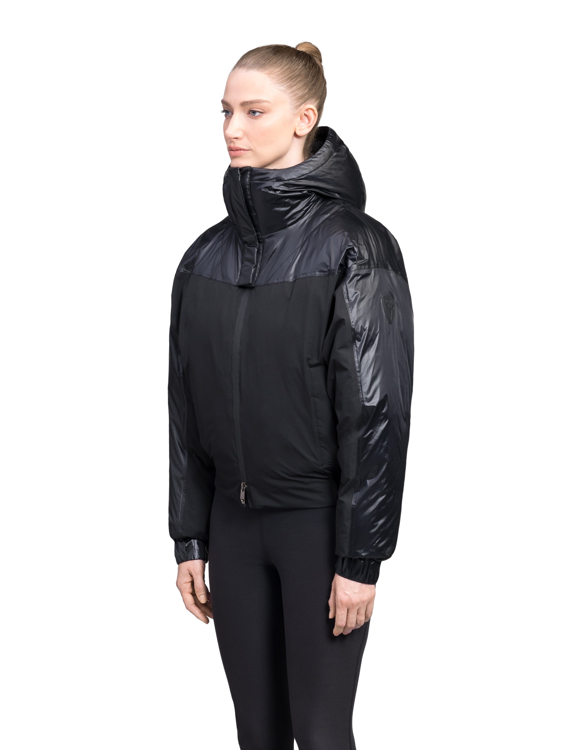 Aspen Women's Batwing Jacket in hip length, premium stretch ripstop and cire technical nylon taffeta fabrication, Premium Canadian White Duck Down insulation, non-removable down-filled hood, centre front two-way zipper, winged arm detailing, in Black