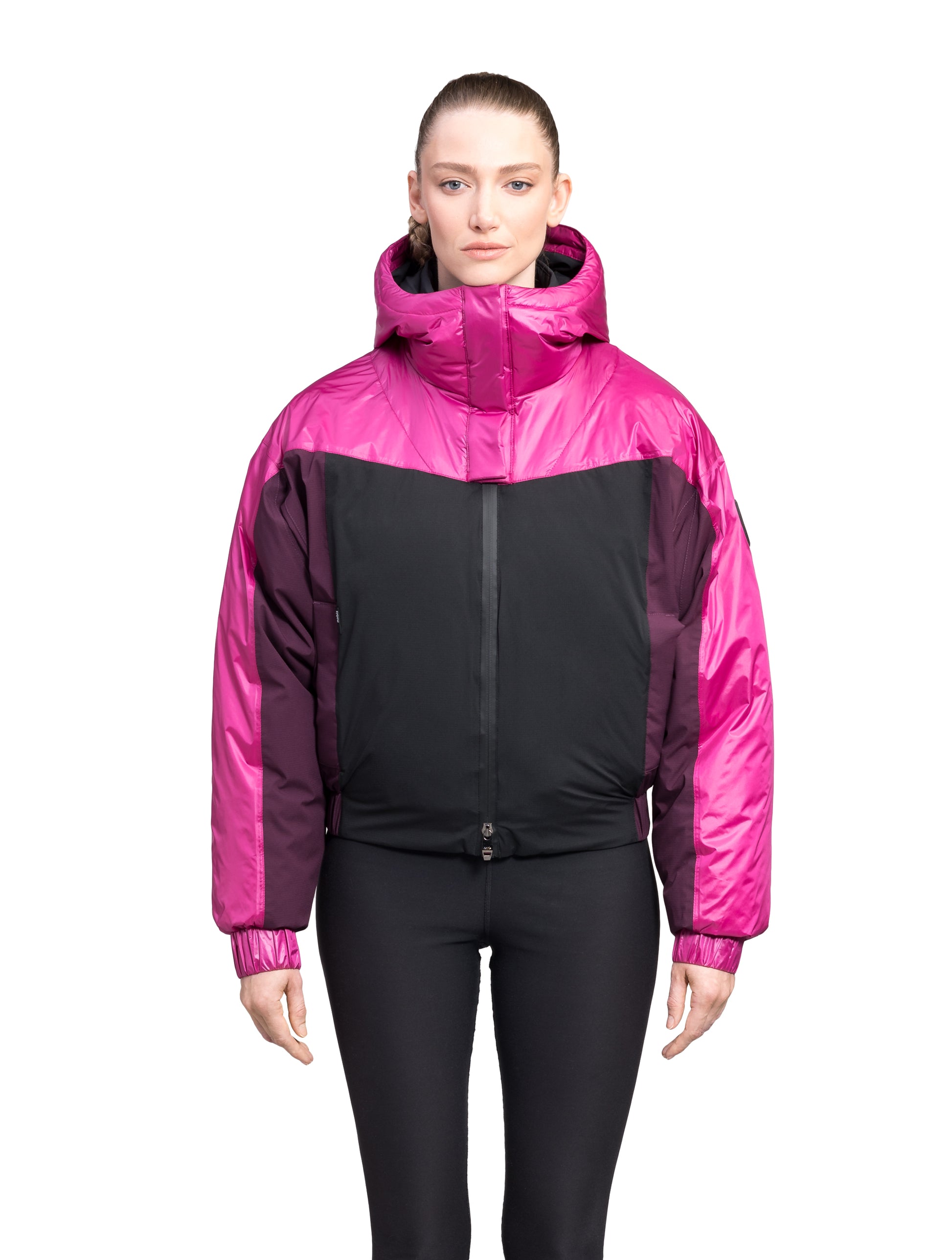 Aspen Women's Batwing Jacket in hip length, premium stretch ripstop and cire technical nylon taffeta fabrication, Premium Canadian White Duck Down insulation, non-removable down-filled hood, centre front two-way zipper, winged arm detailing, in Festival Fushia/Potent Purple