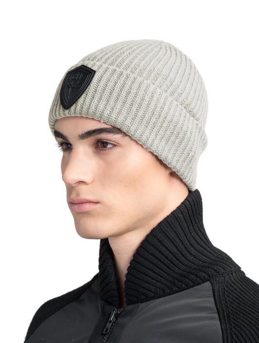 Emer Unisex Tailored Chunky Knit Beanie in extra fine merino wool blend, and black leather Nobis shield logo on cuff, in Wheat