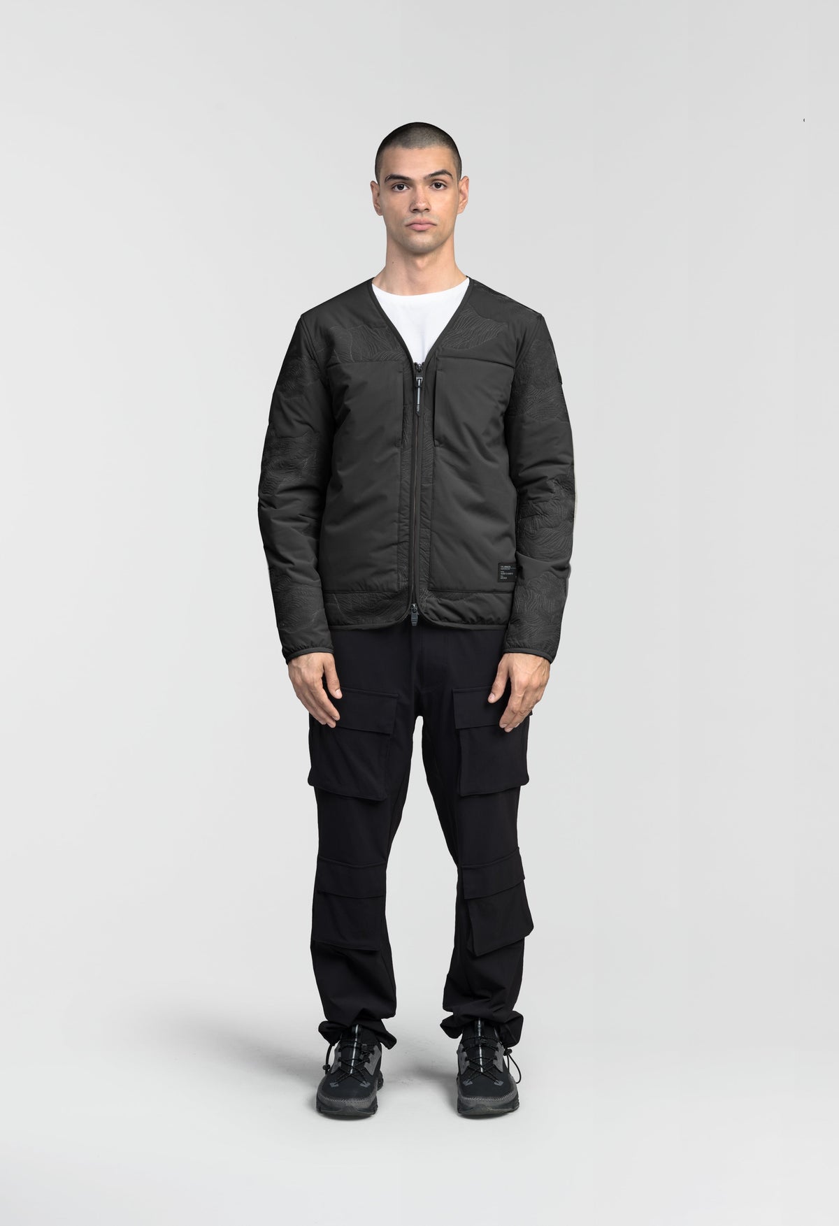Gates Men's Performance Quilted V-Neck Jacket in hip length, centre front two-way zipper, hidden zipper chest pockets, side entry waist pockets, in Black