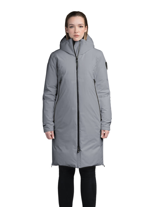 Inara Women's Performance Parka in knee length, premium 3-ply micro denier and stretch ripstop fabrication with DWR coating, Premium Canadian White Duck Down insulation, non-removable down-filled hood, centre front two-way zipper, large vertical zipper pockets along waist, zipper vents along bottom side hem, in Concrete