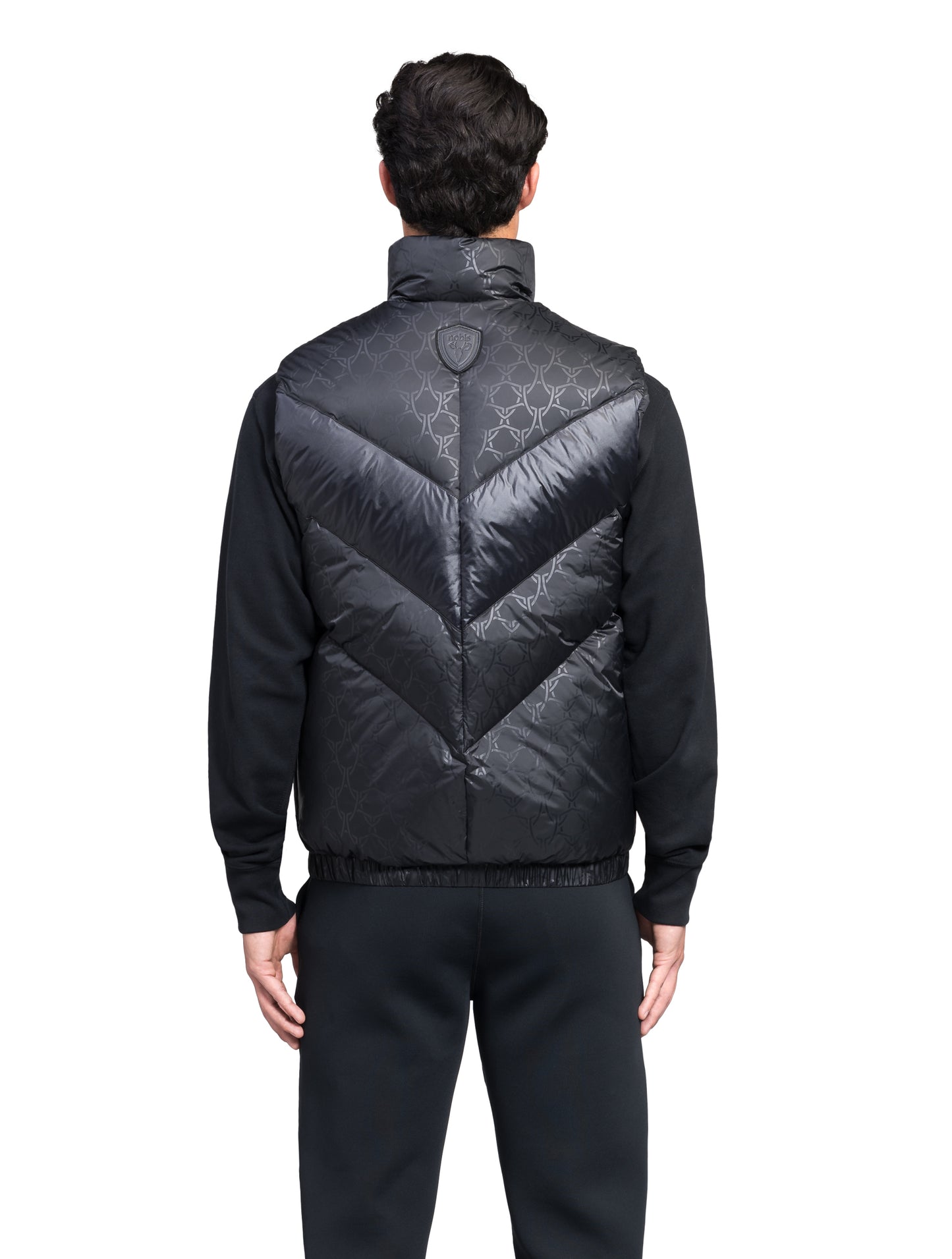 Kylo Men's Chevron Quilted Vest in hip length, premium cire technical nylon taffeta fabrication, Premium Canadian origin White Duck Down insulation, two-way centre-front zipper, fleece-lined pockets at waist, elasticized waistband, in Shield Monogram