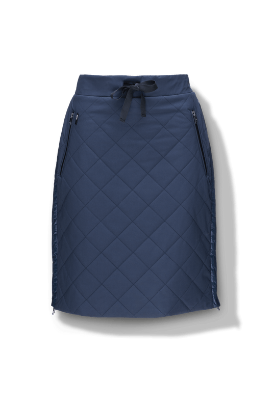 Phora Women's Tailored Skirt in knee length, premium stretch ripstop and contrast cire technical nylon taffeta fabrication, premium 4-way stretch, water resistant Primaloft Gold Insulation Active+, elasticated waistband with grosgrain ribbon drawstrings, two zipper pockets at waist, and zipper closure gusset at side seams, in Marine + Marine