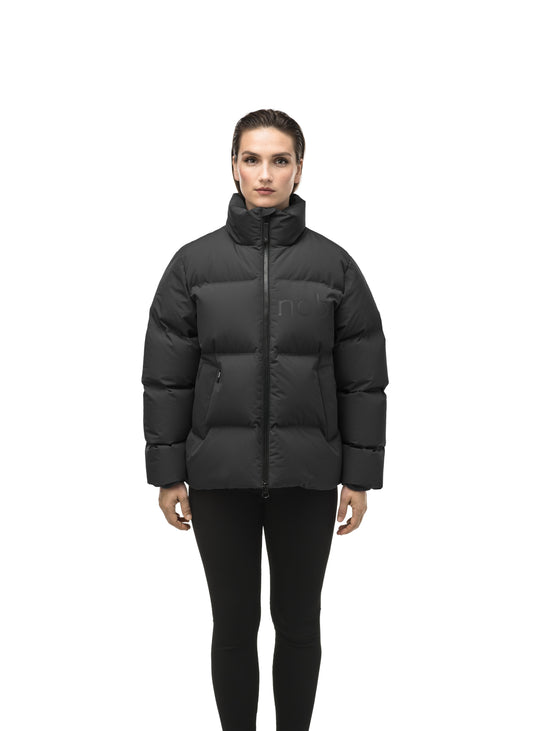 Women's puffer jacket with a minimalist modern design; featuring graphic details like oversized tonal branding, an exposed zipper, and seamless puffer channels to lock in the Premium Canadian Origin White Duck Down in Black + Black