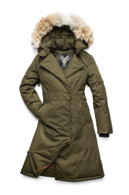 Long calf length women's trench inspired parka with removable fur trim around the hood and an asymetric closure in Fatigue + Fatigue