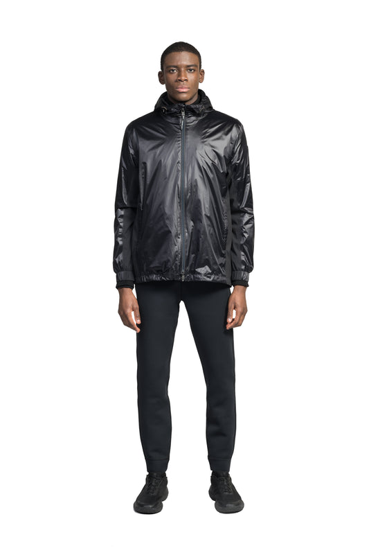 Stratus Men's Tailored Packable Rain Jacket in hip length, premium cire technical nylon taffeta and stretch ripstop fabrication, highly breathable mesh lining, hidden packable pocket, non-removable hood with adjustable draw cord, reflective piping along front and back, underarm grommets for extra breathability, back yoke with mesh ventilation, two waist zipper pockets, two interior zipper pockets, elastic cuffs with adjustable snap button, and adjustable interior draw cord at waist hem, in Black