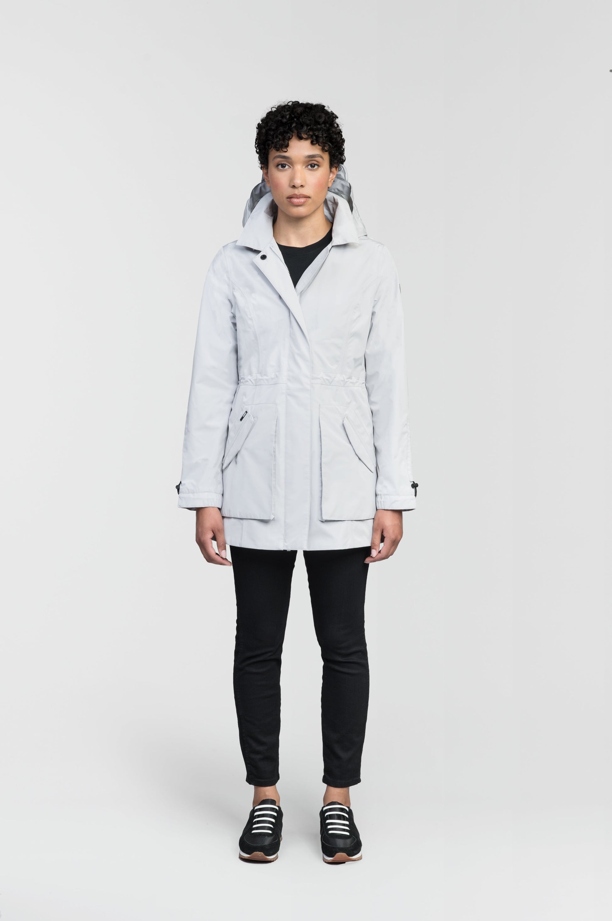 Women's thigh length raincoat with collar and non-removable hood in Light Grey