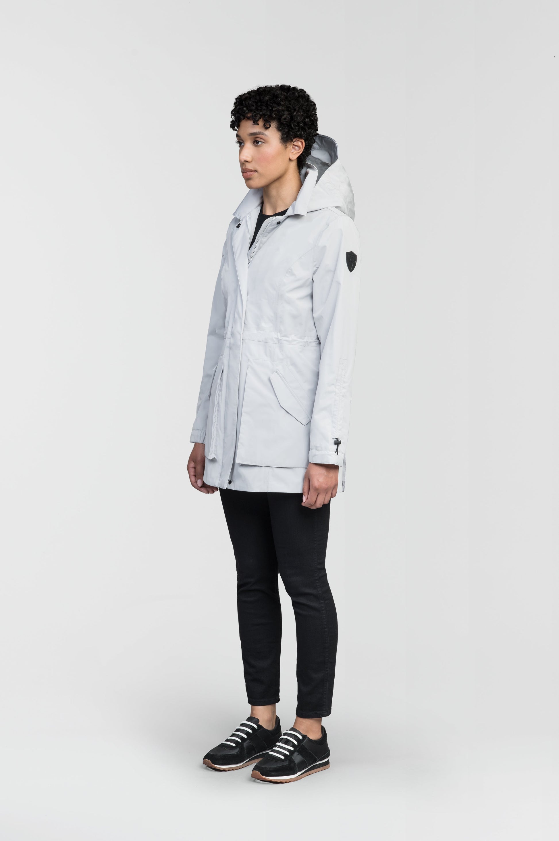 Women's thigh length raincoat with collar and non-removable hood in Light Grey