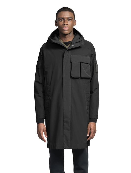 Wylder Men's Performance Rain Jacket in knee length, premium 3-ply Micro Denier and stretch ripstop fabrication, non-removable hood with reflective piping and adjustable draw cord, split utility chest pocket with magnetic flap closure, single welt pockets with magnetic closure at waist, back yoke with mesh ventilation, snap button wind flap, two-way branded zipper at centre front, telescopic sleeves with elasticized cuffs, interior draw cord at waist, in Black + Black