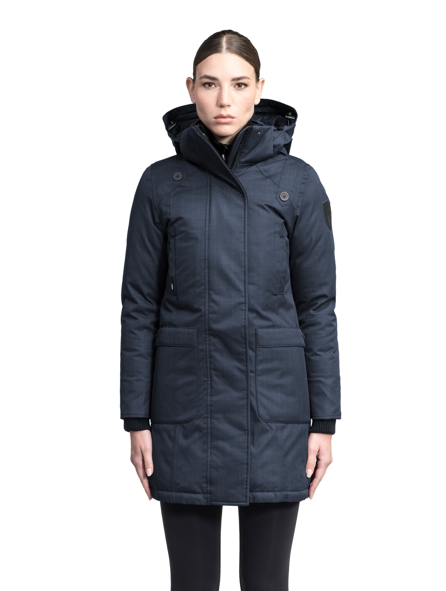 Merideth Furless Ladies Parka in thigh length, Canadian white duck down insulation, removable down-filled hood, centre-front two-way zipper with magnetic wind flap closure, four exterior pockets, and elastic ribbed cuffs, in Navy