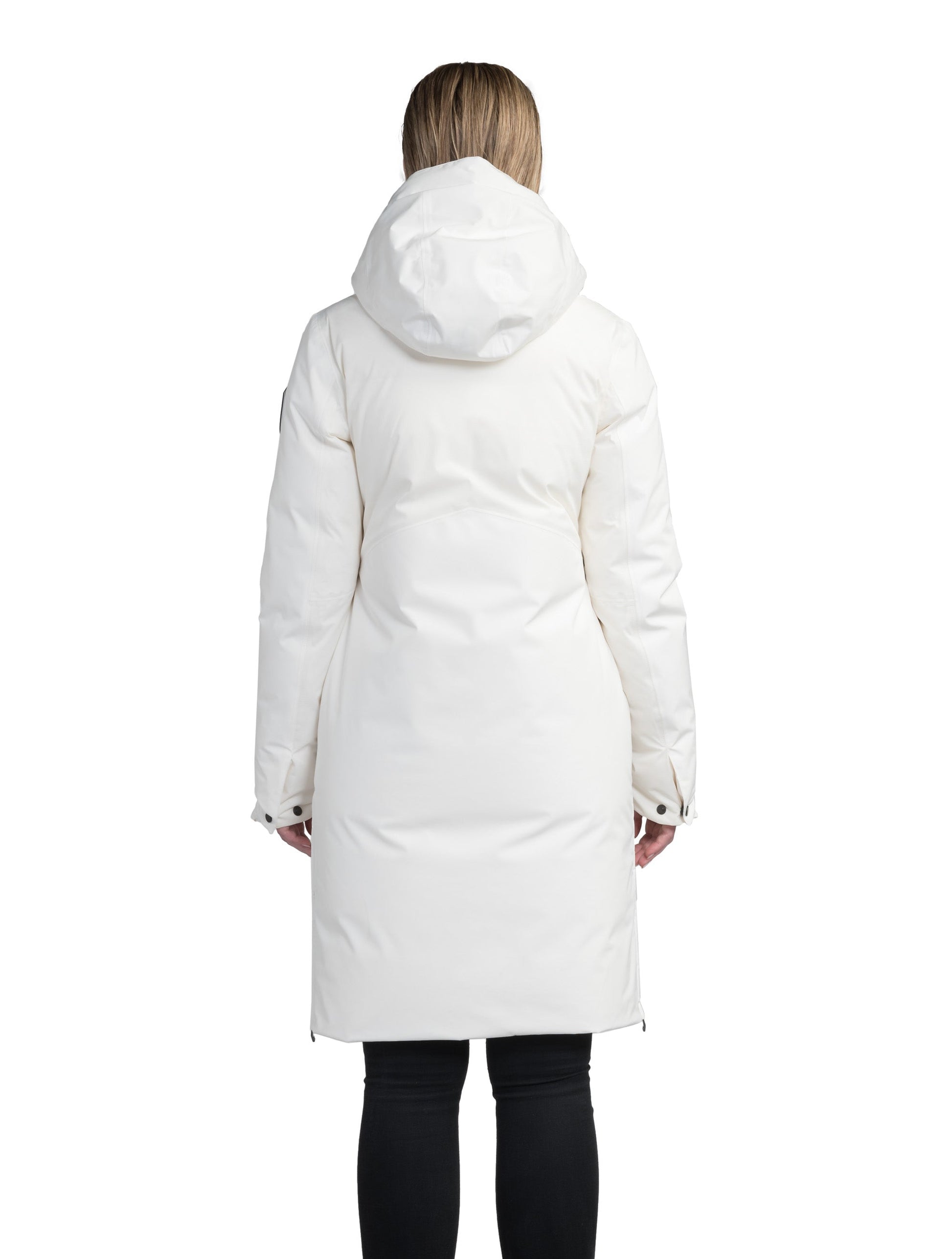 Inara Women's Performance Parka in knee length, premium 3-ply micro denier and stretch ripstop fabrication with DWR coating, Premium Canadian White Duck Down insulation, non-removable down-filled hood, centre front two-way zipper, large vertical zipper pockets along waist, zipper vents along bottom side hem, in Chalk