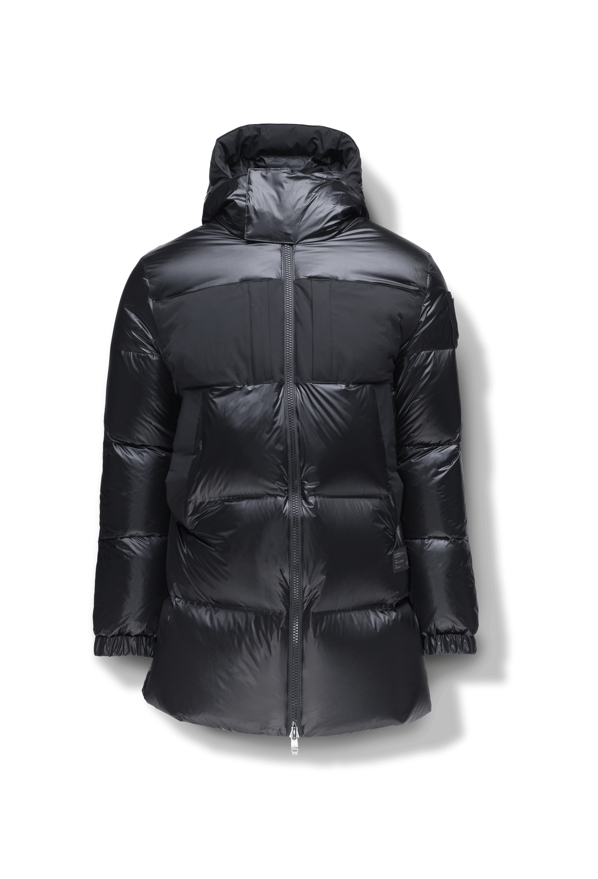 Neelix Men's Long Puffer Jacket in thigh length, premium cire technical nylon taffeta and stretch ripstop fabrication, Premium Canadian origin White Duck Down insulation, non-removable down-filled hood, two-way centre-front zipper, pit zipper vents, hidden chest zipper pockets, fleece-lined magnetic closure waist pockets, in Black