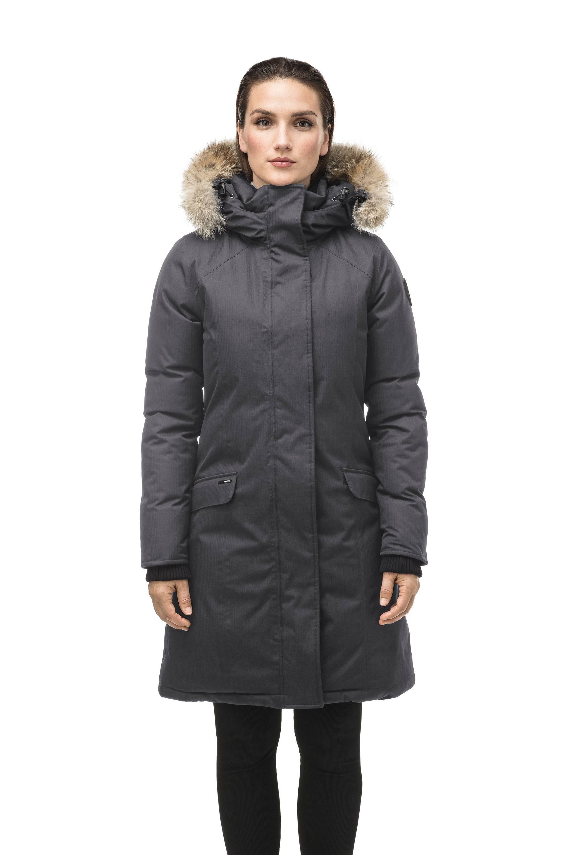 Rebecca Women's Parka in knee length, Canadian duck down insulation, two-way zipper with magnetic front placket, non-removable hood with removable coyote fur trim, in Steel Grey