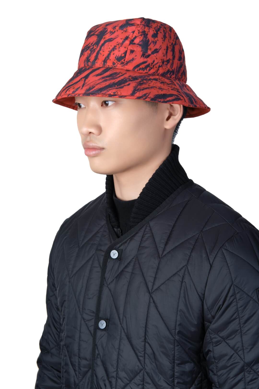 Lunar New Year Reversible Bucket Hat with one side in red tiger print, and the reverse side in tonal red with Nobis label branding on the crown front, in Vermillion