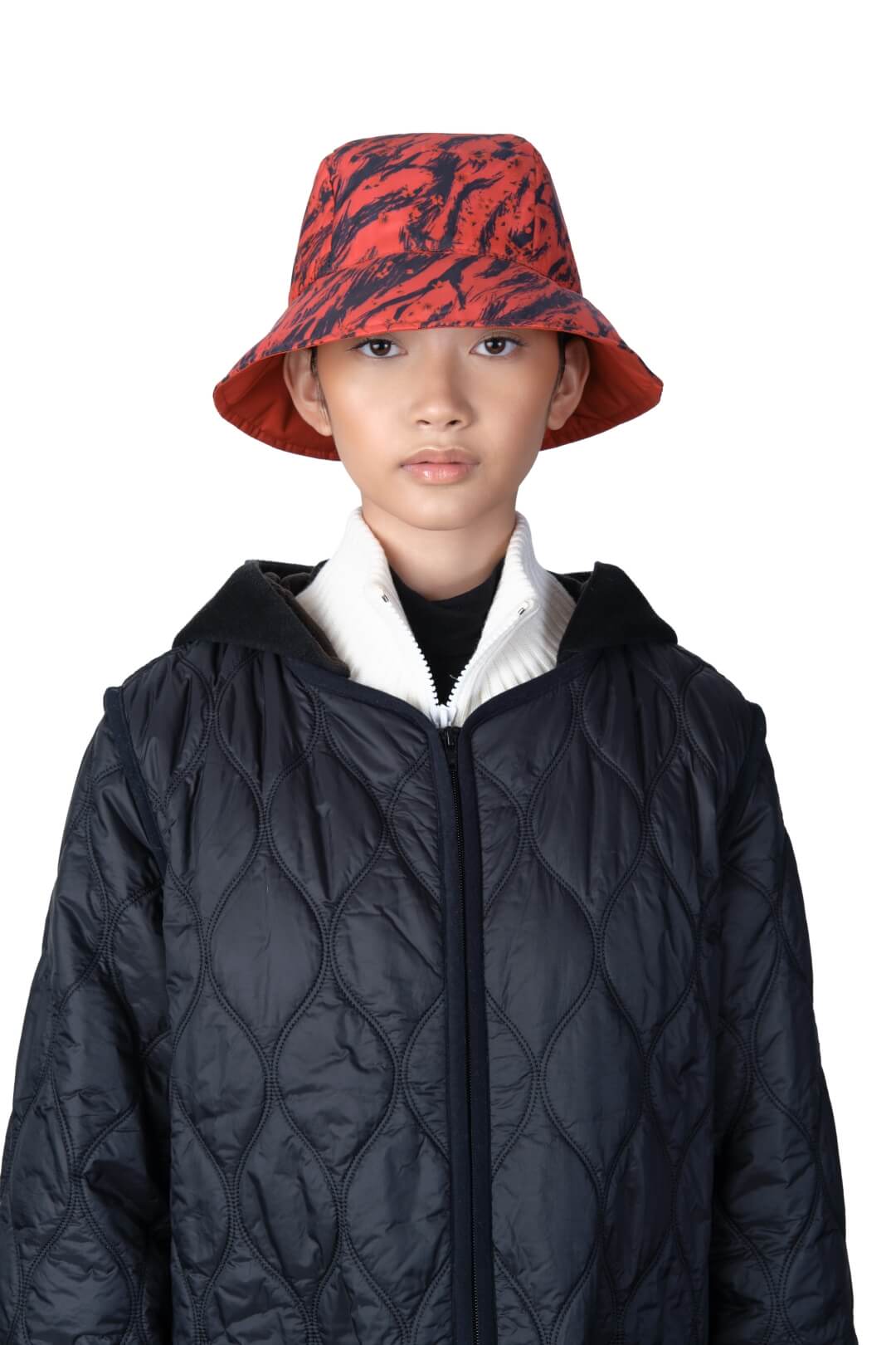 Lunar New Year Reversible Bucket Hat with one side in red tiger print, and the reverse side in tonal red with Nobis label branding on the crown front, in Vermillion