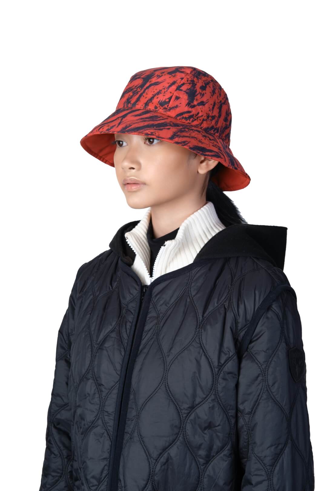 Lunar New Year Reversible Bucket Hat with one side in red tiger print, and the reverse side in tonal red with Nobis label branding on the crown front, in Vermillion