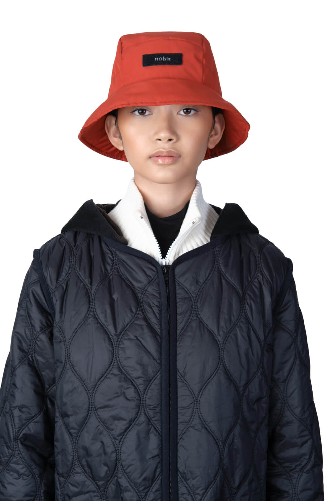 Lunar New Year Reversible Bucket Hat with one side in red tiger print, and the reverse side in tonal red with Nobis label branding on the crown front, in Vermillion